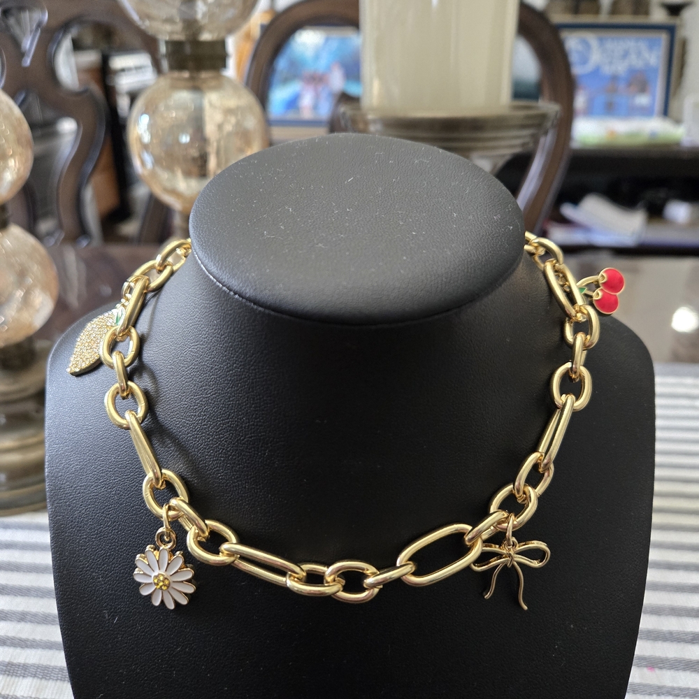 Gold Charm Bag with Daisy and Bow Accents